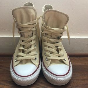 Cream colored high top Converse
